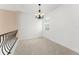 Second floor loft with carpet and view of the neighborhood at 7699 Milano Dr, Orlando, FL 32835