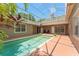 Enclosed private pool with a screen, brick patio, and lush surroundings for a peaceful retreat at 7699 Milano Dr, Orlando, FL 32835