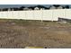 Large leveled backyard surrounded by a pristine white fence, perfect for outdoor activities at 809 River Stone Trl, Sanford, FL 32771