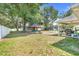 Lush green backyard featuring a covered gazebo, partially fenced yard and plenty of room to relax and unwind at 812 Deep Wood Ct, Fruitland Park, FL 34731