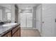 Bathroom features a tiled shower with glass doors, neutral paint, and a granite sink vanity at 812 Deep Wood Ct, Fruitland Park, FL 34731