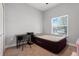 Bedroom with desk, air mattress, and natural light through window at 812 Deep Wood Ct, Fruitland Park, FL 34731