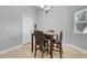 Cozy dining area with a wooden table set and natural light from the window at 812 Deep Wood Ct, Fruitland Park, FL 34731