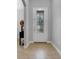 Bright entryway with a decorative glass front door and neutral-toned flooring at 812 Deep Wood Ct, Fruitland Park, FL 34731