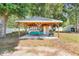 Backyard recreational space with a pool table and bar at 812 Deep Wood Ct, Fruitland Park, FL 34731