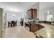 Modern kitchen features stainless steel appliances, granite countertops, and dark wood cabinetry at 812 Deep Wood Ct, Fruitland Park, FL 34731