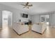 Comfortable living area featuring tile flooring, vaulted ceiling, and a view to the backyard at 812 Deep Wood Ct, Fruitland Park, FL 34731