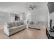 Spacious living room with tile flooring, ceiling fan, and neutral decor at 812 Deep Wood Ct, Fruitland Park, FL 34731