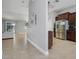 Open-concept living area with tile floors seamlessly connecting the kitchen and living room at 812 Deep Wood Ct, Fruitland Park, FL 34731