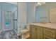 Bathroom featuring single sink vanity and walk in shower with a glass door at 887 Lancer Cir, Ocoee, FL 34761