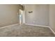 Empty bedroom with neutral walls and carpet and entryway to other rooms at 887 Lancer Cir, Ocoee, FL 34761