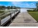 Features a private boat dock and ramp extending onto the tranquil lake at 887 Lancer Cir, Ocoee, FL 34761