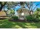 Charming gazebo situated in a well-maintained communal space, surrounded by lush landscaping and mature trees at 887 Lancer Cir, Ocoee, FL 34761