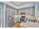 Modern kitchen featuring stainless steel appliances and light gray cabinets at 887 Lancer Cir, Ocoee, FL 34761