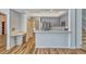 Open concept kitchen offering stainless steel appliances and eat in counter at 887 Lancer Cir, Ocoee, FL 34761
