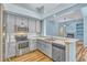 Well-lit kitchen open to the living area, equipped with stainless steel appliances at 887 Lancer Cir, Ocoee, FL 34761