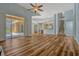 Open-concept living space with a fireplace and easy access to the kitchen and pool area at 887 Lancer Cir, Ocoee, FL 34761