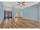 Open living room with stunning wood floors, high ceilings, and an abundance of natural light at 887 Lancer Cir, Ocoee, FL 34761