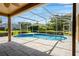Screened-in in-ground pool with patio at 887 Lancer Cir, Ocoee, FL 34761