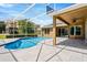 Screened-in in-ground pool with patio and ceiling fan at 887 Lancer Cir, Ocoee, FL 34761