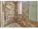 Shower with river rock flooring and textured tile at 887 Lancer Cir, Ocoee, FL 34761