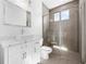Modern bathroom featuring a sleek vanity with a white vessel sink and a glass-enclosed shower with tile surround at 9265 Eagles Perch Pl, Orlando, FL 32825