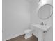 Bathroom featuring a pedestal sink, modern faucet, and toilet at 9265 Eagles Perch Pl, Orlando, FL 32825