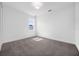 Bright, carpeted bedroom with large window, neutral walls, and recessed lighting. Ready for personalization at 9265 Eagles Perch Pl, Orlando, FL 32825