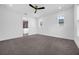 A spacious bedroom with carpeted floors, ample natural light, and an en-suite bathroom at 9265 Eagles Perch Pl, Orlando, FL 32825