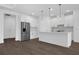 Bright kitchen with white cabinets, stainless steel appliances, and an island, perfect for entertaining at 9265 Eagles Perch Pl, Orlando, FL 32825