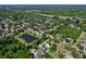 Scenic aerial view of community featuring nearby lake and lush tree coverage at 934 Jessamy St, Oviedo, FL 32765