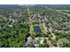 Scenic aerial view of community and Oviedo High School with nearby lake and lush tree coverage at 934 Jessamy St, Oviedo, FL 32765