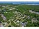 Scenic aerial view of community featuring nearby lake and lush tree coverage at 934 Jessamy St, Oviedo, FL 32765