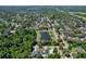 Scenic aerial view of community featuring nearby lake and lush tree coverage at 934 Jessamy St, Oviedo, FL 32765