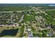 Scenic aerial view of community featuring nearby lake and lush tree coverage at 934 Jessamy St, Oviedo, FL 32765