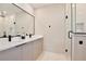 Modern bathroom features a double vanity, sleek fixtures, and glass-enclosed shower at 934 Jessamy St, Oviedo, FL 32765