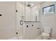 Contemporary bathroom showcases a glass shower, square shower head, and modern toilet at 934 Jessamy St, Oviedo, FL 32765