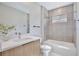 Bathroom includes a large vanity, shower/tub combo, toilet and window at 934 Jessamy St, Oviedo, FL 32765