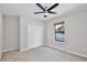 Bedroom with neutral carpet, a ceiling fan, a window and a closet at 934 Jessamy St, Oviedo, FL 32765