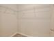 Walk-in closet features white wire shelving and neutral carpet at 934 Jessamy St, Oviedo, FL 32765