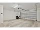 Spacious garage with automatic door opener and concrete floor, perfect for parking and storage at 934 Jessamy St, Oviedo, FL 32765