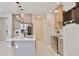 Contemporary kitchen with stainless steel appliances, a quartz island, and modern pendant lighting at 934 Jessamy St, Oviedo, FL 32765