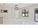 Bright living room with marble floors, modern lighting, and a wine rack detail at 934 Jessamy St, Oviedo, FL 32765