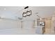 Open living space featuring modern light fixtures, marble floors, and neutral paint at 934 Jessamy St, Oviedo, FL 32765