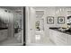 Modern bathroom with glass shower, double vanity with black countertops, and contemporary fixtures at 960 Club Cresswind Dr, Lady Lake, FL 32159