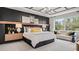 Stylish bedroom featuring a decorative headboard, modern lighting, and a cozy seating area at 960 Club Cresswind Dr, Lady Lake, FL 32159
