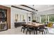 Contemporary dining room with a large square table, modern chairs, and stylish decor at 960 Club Cresswind Dr, Lady Lake, FL 32159
