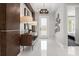 Elegant entryway with modern lighting, decorative wall art, and a sleek console table with lamps at 960 Club Cresswind Dr, Lady Lake, FL 32159