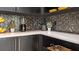 Kitchen featuring marble countertops, modern appliances, and black cabinetry for a sleek design at 960 Club Cresswind Dr, Lady Lake, FL 32159