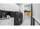Well-organized laundry room with modern appliances, ample storage, and a convenient sink area at 960 Club Cresswind Dr, Lady Lake, FL 32159